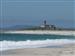 La increible playa de Lariño con el faro al fondo justo debajo del pueblo